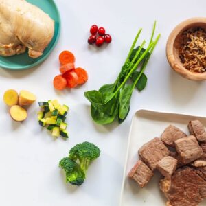 Variety of fresh, whole foods including meats and veggies